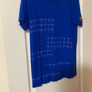 Tesla men’s shirt size small with t logo on it.